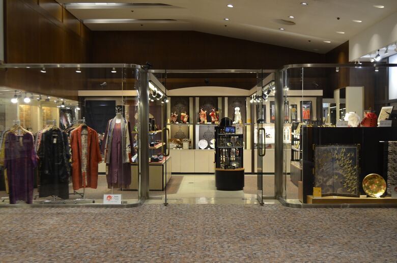 Front view of a Japanese gift shop selling traditional garments and artisan crafts.
